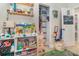 Bedroom featuring play area, closet storage and neutral decor at 845 Edgewater Cir, Eustis, FL 32726