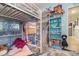 A room features a cozy loft bed with storage and a closet filled with toys and accessories at 845 Edgewater Cir, Eustis, FL 32726