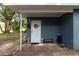 Charming covered front porch with seating and decorative touches, creating a warm and inviting entrance at 845 Edgewater Cir, Eustis, FL 32726