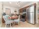 Bright eat-in kitchen featuring stainless steel appliances and ample storage space at 845 Edgewater Cir, Eustis, FL 32726
