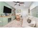 A cozy living room featuring built-in shelving, a comfortable sofa, and lots of natural light at 845 Edgewater Cir, Eustis, FL 32726