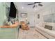 A cozy living room featuring built-in shelving, a comfortable sofa, and lots of natural light at 845 Edgewater Cir, Eustis, FL 32726