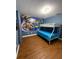Bright bedroom features a vibrant wall graphic and a bunk bed, perfect for  at 8894 Candy Palm Rd, Kissimmee, FL 34747