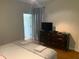 This bedroom offers a dresser and serene ambiance at 8894 Candy Palm Rd, Kissimmee, FL 34747