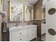 Bathroom features a double sink vanity with sleek white cabinets and modern lighting at 9326 Bay Vista Estates Blvd, Orlando, FL 32836