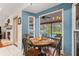 Cozy breakfast nook with views of the pool and backyard from a large window at 9326 Bay Vista Estates Blvd, Orlando, FL 32836