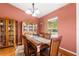 Dining room featuring a wooden dining set, wooden furniture, and a window at 9326 Bay Vista Estates Blvd, Orlando, FL 32836