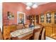 Dining room featuring a wooden dining set, wooden furniture, and a light fixture at 9326 Bay Vista Estates Blvd, Orlando, FL 32836