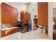 Bright kitchen boasts wood cabinets, quartz counters, mosaic backsplash, and stainless steel appliances at 9326 Bay Vista Estates Blvd, Orlando, FL 32836