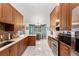 Beautiful kitchen with custom cabinets, stainless steel appliances, and tile floors at 9326 Bay Vista Estates Blvd, Orlando, FL 32836