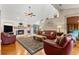 Spacious living room with a fireplace, hardwood floors, and an open layout at 9326 Bay Vista Estates Blvd, Orlando, FL 32836