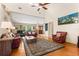 Bright living room featuring vaulted ceilings, hardwood floors, and plenty of natural light at 9326 Bay Vista Estates Blvd, Orlando, FL 32836