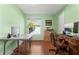 Bright home office with a window and wood floors, ideal for remote work or study at 9326 Bay Vista Estates Blvd, Orlando, FL 32836