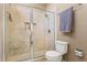 Walk-in shower with tile surround, glass door and shower head at 9326 Bay Vista Estates Blvd, Orlando, FL 32836