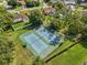 Aerial view of community tennis courts surrounded by lush greenery and neighborhood homes at 9326 Bay Vista Estates Blvd, Orlando, FL 32836