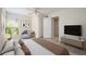 Inviting bedroom with neutral decor, a comfortable chair, and ample natural light at 940 Douglas Ave # 132, Altamonte Springs, FL 32714