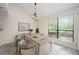 Dining room with large window, modern light fixture, and neutral decor at 940 Douglas Ave # 132, Altamonte Springs, FL 32714