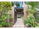 Charming entrance with a gated front patio area, mature landscaping, and a cozy feel at 940 Douglas Ave # 132, Altamonte Springs, FL 32714