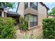 Beautiful exterior view with a gated entrance, lush landscaping, and a two-story design at 940 Douglas Ave # 132, Altamonte Springs, FL 32714
