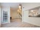 Open-concept living room boasts a fireplace, modern floors, and staircase access to upper level at 940 Douglas Ave # 132, Altamonte Springs, FL 32714