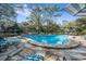 Community pool and patio area with sun loungers, perfect for outdoor relaxation and recreation at 940 Douglas Ave # 132, Altamonte Springs, FL 32714