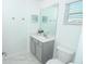 Clean half-bathroom with a single sink, toilet, and modern fixtures at 976 Leader St, Davenport, FL 33896
