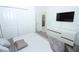 This bedroom features carpet flooring, a large closet, and a minimalist aesthetic at 976 Leader St, Davenport, FL 33896