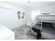 Charming bedroom with a bunk bed and playful Mickey and Minnie Mouse wall decor at 976 Leader St, Davenport, FL 33896