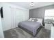 Serene bedroom featuring a queen bed, carpeted floor, and natural light at 976 Leader St, Davenport, FL 33896