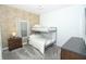 This bedroom features a bunk bed, gray carpet flooring, and a dark dresser at 976 Leader St, Davenport, FL 33896