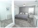 Cozy bedroom featuring a queen bed, carpeted floor, and lots of storage at 976 Leader St, Davenport, FL 33896