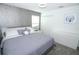 Calm bedroom showcasing a queen bed, carpeted floor, and sleek dresser at 976 Leader St, Davenport, FL 33896