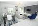 Open-concept living room and dining area with modern decor and ample natural light at 976 Leader St, Davenport, FL 33896