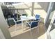 This covered patio showcases outdoor dining furniture, creating a cozy spot for entertaining at 976 Leader St, Davenport, FL 33896