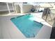 Sparkling pool surrounded by a patio, enclosed with a safety fence, offering a refreshing outdoor experience at 976 Leader St, Davenport, FL 33896