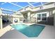 Enclosed pool and patio area featuring a safety fence, providing a secure and enjoyable outdoor retreat at 976 Leader St, Davenport, FL 33896