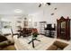 Spacious living area with tiled floors, open layout to the kitchen, and dining space at 9814 Piney Point Cir, Orlando, FL 32825