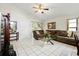Spacious living room offering tiled floors and comfortable seating, perfect for relaxation at 9814 Piney Point Cir, Orlando, FL 32825