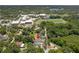 An aerial view showcasing its location, close to schools and neighborhood with lush surrounding greenery at 1031 Morningside Dr, Eustis, FL 32726