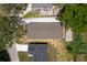 An aerial view of the roof of a single-story home showing the roof and surrounding landscape at 1031 Morningside Dr, Eustis, FL 32726