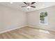 Bedroom with ceiling fan, hardwood floor, and bright light at 1031 Morningside Dr, Eustis, FL 32726