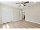 Bedroom with ceiling fan, and a door to the kitchen at 1031 Morningside Dr, Eustis, FL 32726