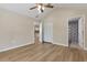 Bedroom with ceiling fan, and two doors one to the kitchen and one to the bathroom at 1031 Morningside Dr, Eustis, FL 32726