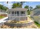 Charming single-story home with a cozy front porch, complemented by a lush green lawn at 1031 Morningside Dr, Eustis, FL 32726