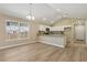 Modern kitchen with a breakfast bar, sleek countertops, and bright lighting at 1031 Morningside Dr, Eustis, FL 32726