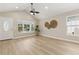 Airy living room featuring ample natural light, vaulted ceilings, and stylish decor at 1031 Morningside Dr, Eustis, FL 32726