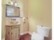 Well-appointed powder room featuring a unique vanity sink and a decorative mirror at 12663 Hawkstone Dr, Windermere, FL 34786