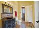 Bathroom featuring a copper sink, tile backsplash and a glass enclosed shower at 12663 Hawkstone Dr, Windermere, FL 34786