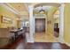 Elegant foyer with stately columns, hardwood floors, and double doors to the entrance at 12663 Hawkstone Dr, Windermere, FL 34786