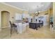Spacious kitchen features granite countertops, stainless steel appliances, and a large center island at 12663 Hawkstone Dr, Windermere, FL 34786